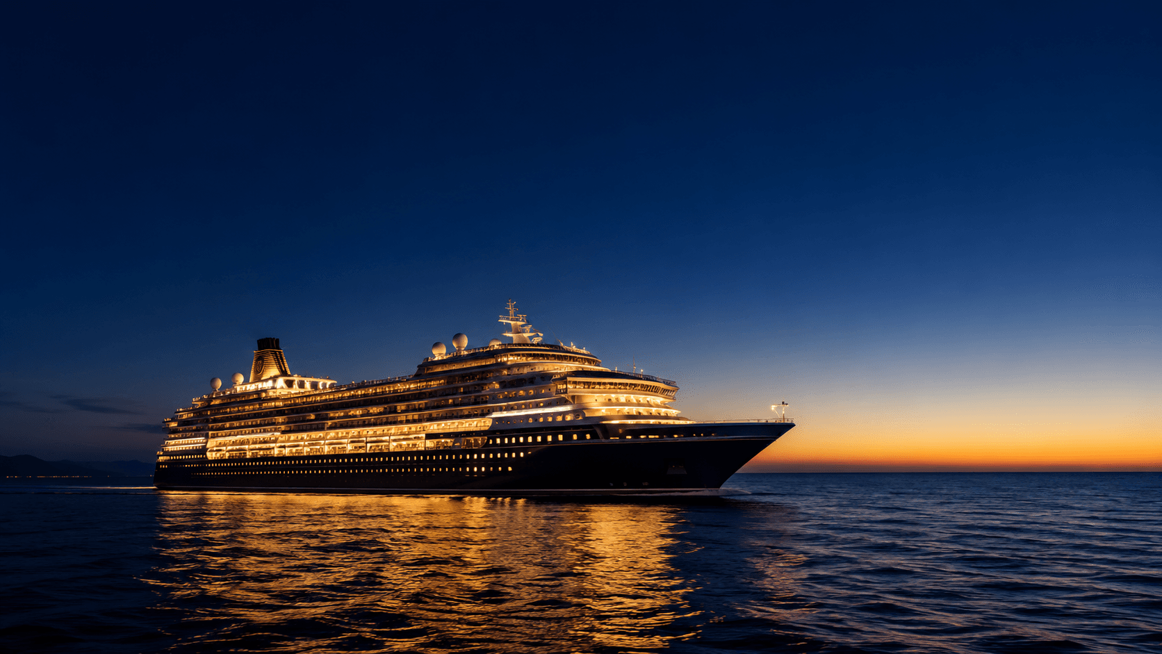 Luxury cruise ship lit up at dusk on a calm ocean